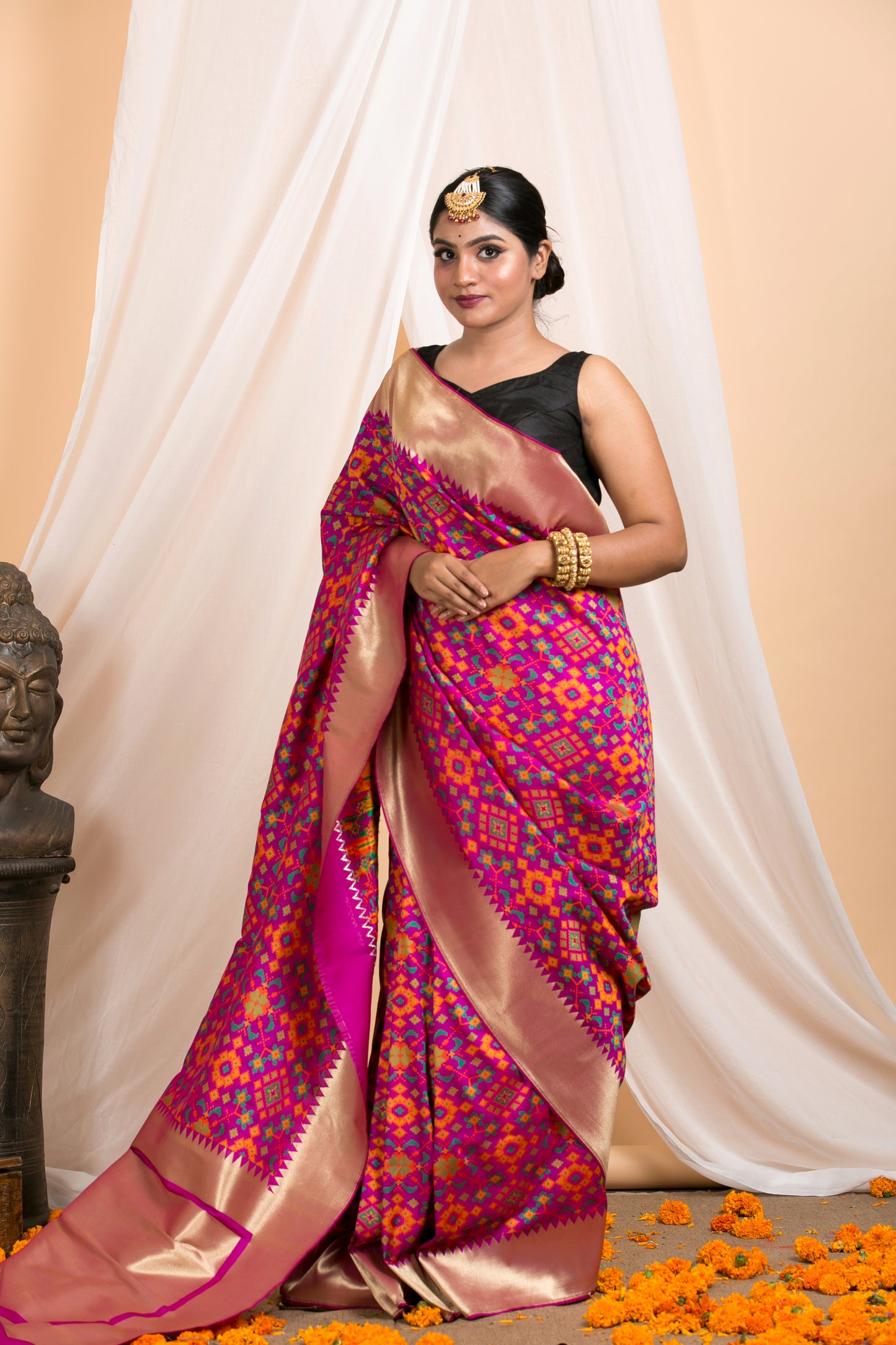 purple banarasi saree with patola pattern